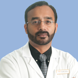 Dr. Ajit Tharakan